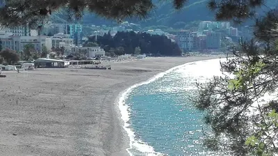 a view of a beach with a city in the background at Apartment-Hotel Vila Petrovic-Becici in Budva