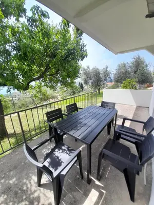 a picnic table and chairs on a patio at Top see in Bar