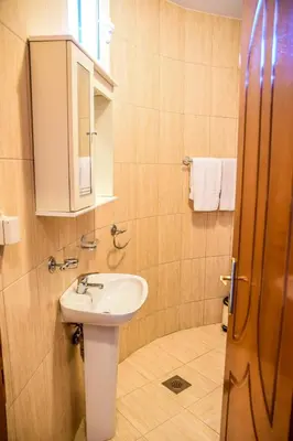 a bathroom with a sink and a mirror at Eldorado Apartments in Ulcinj