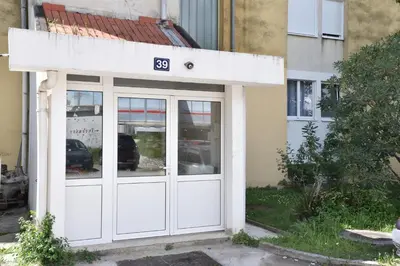 a building with a door with the number at D&D Apartment 1 in Budva