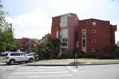 a white car parked in front of a building at D&D Apartments 3 in Budva