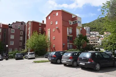 a group of cars parked in a parking lot at D&D Apartments 3 in Budva