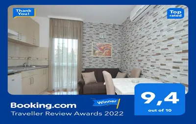a room with a kitchen and a dining room at D&D Apartments 3 in Budva