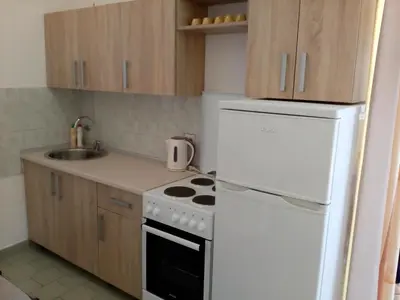 a kitchen with a white stove and a white refrigerator at Villa Marija Ulcinj in Ulcinj
