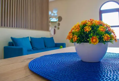 a vase filled with flowers sitting on a table at Apartments Kan in Ulcinj