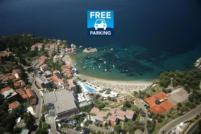 an aerial view of a beach with a bus on it at Apt 