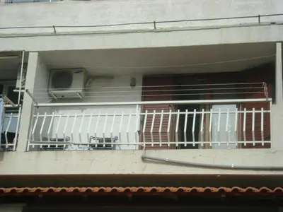 a balcony of a building with a skateboard on it at Apartment Matea in Petrovac na Moru