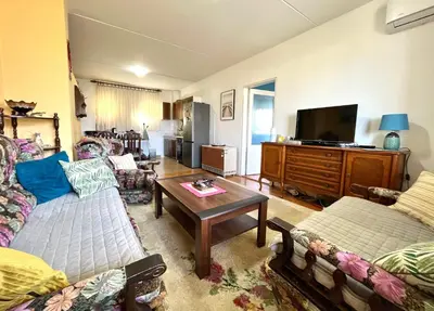 a living room with two couches and a tv at Albatros Apartments in Bar