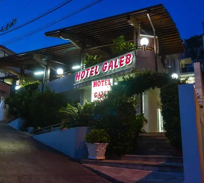 a sign for a motel calledlords in front of a building at Hotel Galeb in Čanj