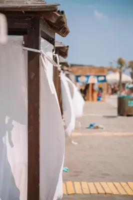 a boat is tied to a wooden post at MCM Camping in Ulcinj