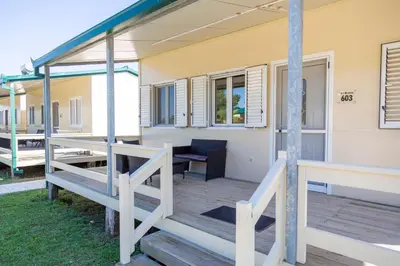 a front porch of a house with a deck at MCM Camping in Ulcinj