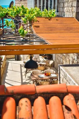 an overhead view of a patio with tables and chairs at Villa Marinero in Ulcinj