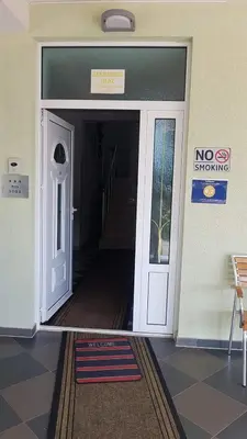 a door to a building with a no entrance sign at Guest House Vila Mimoza in Ulcinj