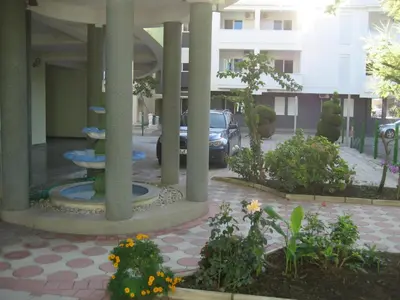 a courtyard with a fountain in the middle of a building at Guest House Vila Mimoza in Ulcinj