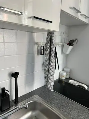 a kitchen with a sink and a counter top at Apartments Mitende in Budva