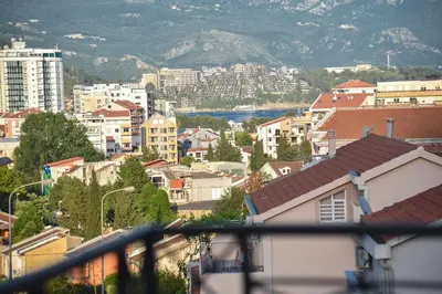 a view of a city with buildings and a mountain at Bologna Apartments in Budva