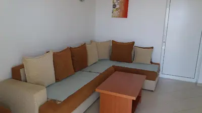 a couch and a table in a room at Apartments 3ADE in Ulcinj