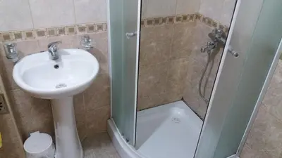 a bathroom with a sink and a shower at Apartments 3ADE in Ulcinj