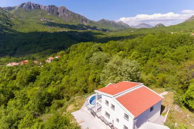 an aerial view of a house with a red roof at Yokana Villa & Pool in Virpazar