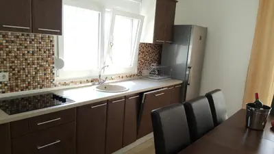 a kitchen with a sink and a window at Yokana Villa & Pool in Virpazar