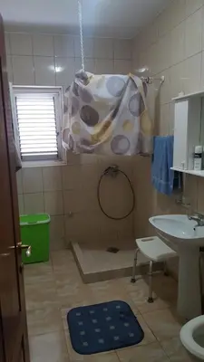 a bathroom with a sink and a cow blanket at Room 4 U in Bar