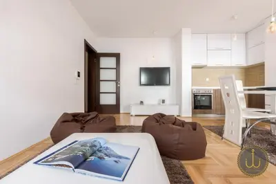a living room with a couch and a table at Ancora 1 in Budva