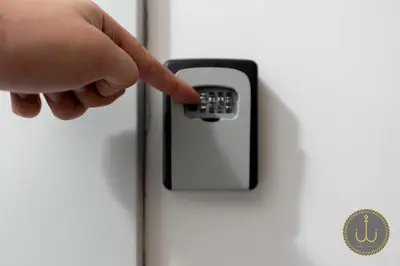 a hand pressing a button on a refrigerator door at Ancora 1 in Budva