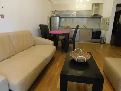 a living room with a couch and a table at Apartments Svilen Konac in Budva