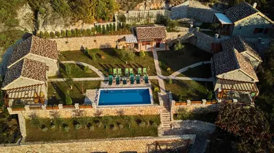 an aerial view of a house with a swimming pool at Eco Resort Cermeniza in Virpazar