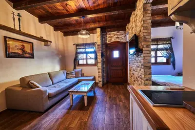 a living room with a couch and a table at Eco Resort Cermeniza in Virpazar