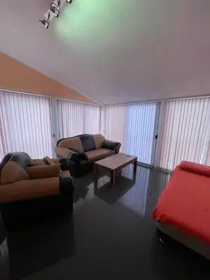 a living room with two couches and a couch at Apartment Crocus of Rafailovici in Budva