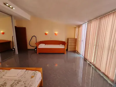a large room with a bed and a large window at Apartment Crocus of Rafailovici in Budva