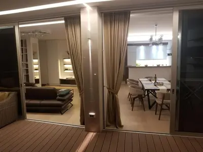 a living room and dining room with a dining table at Duklej Apartment LUX in Budva