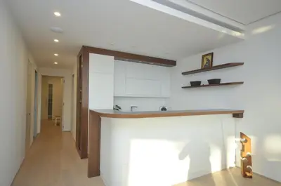 a kitchen with white cabinets and a counter at Duklej Apartment LUX in Budva