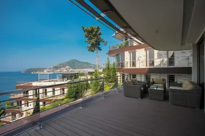 a balcony of a house with a view of the ocean at Duklej Apartment LUX in Budva