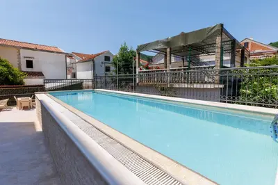 a large blue swimming pool on top of a building at Hotel Kadmo by Aycon in Budva