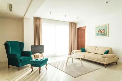 a living room with a couch and a chair at Hotel Kadmo by Aycon in Budva