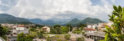 a view of a city with mountains in the background at Apartments Davor in Bar