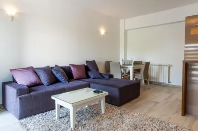 a living room with a couch and a table at Apartments Davor in Bar