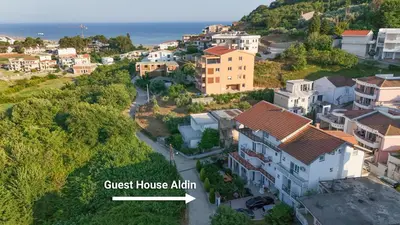an aerial view of a town with the ocean at Guest House Aldin in Ulcinj