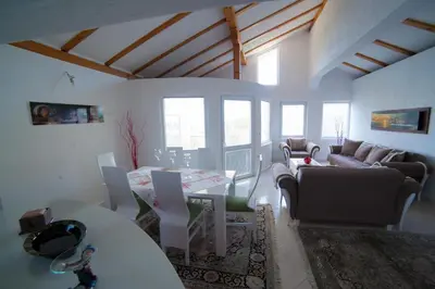 a living room with a couch and a table at Guest House Aldin in Ulcinj
