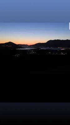 a view of the sunset from the top of a hill at Apartment Jelena Sutvara in Kotor
