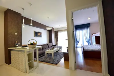 a living room with a couch and a table at Luxury Apartments Mia in Budva