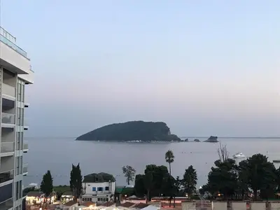 a view of a large body of water with an island at Luxury Apartments Mia in Budva