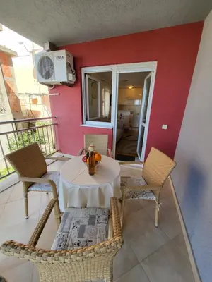 a patio with a table and chairs on a balcony at Apartment Rachel in Petrovac na Moru