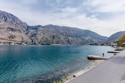a view of a lake with mountains in the background at Sea Holiday Muo with Sea and City View in Kotor