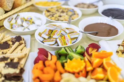 a table filled with different types of food and desserts at Atlantic Hotel in Dobra Voda