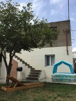 a house with a inflatable bed in front of a building at Holiday Home Aksentijevic in Sutomore