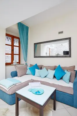 a living room with a couch and a table at La Dolce Vita Apartment in Kotor