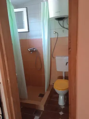 a bathroom with a toilet and a shower at Star Home in Kotor
